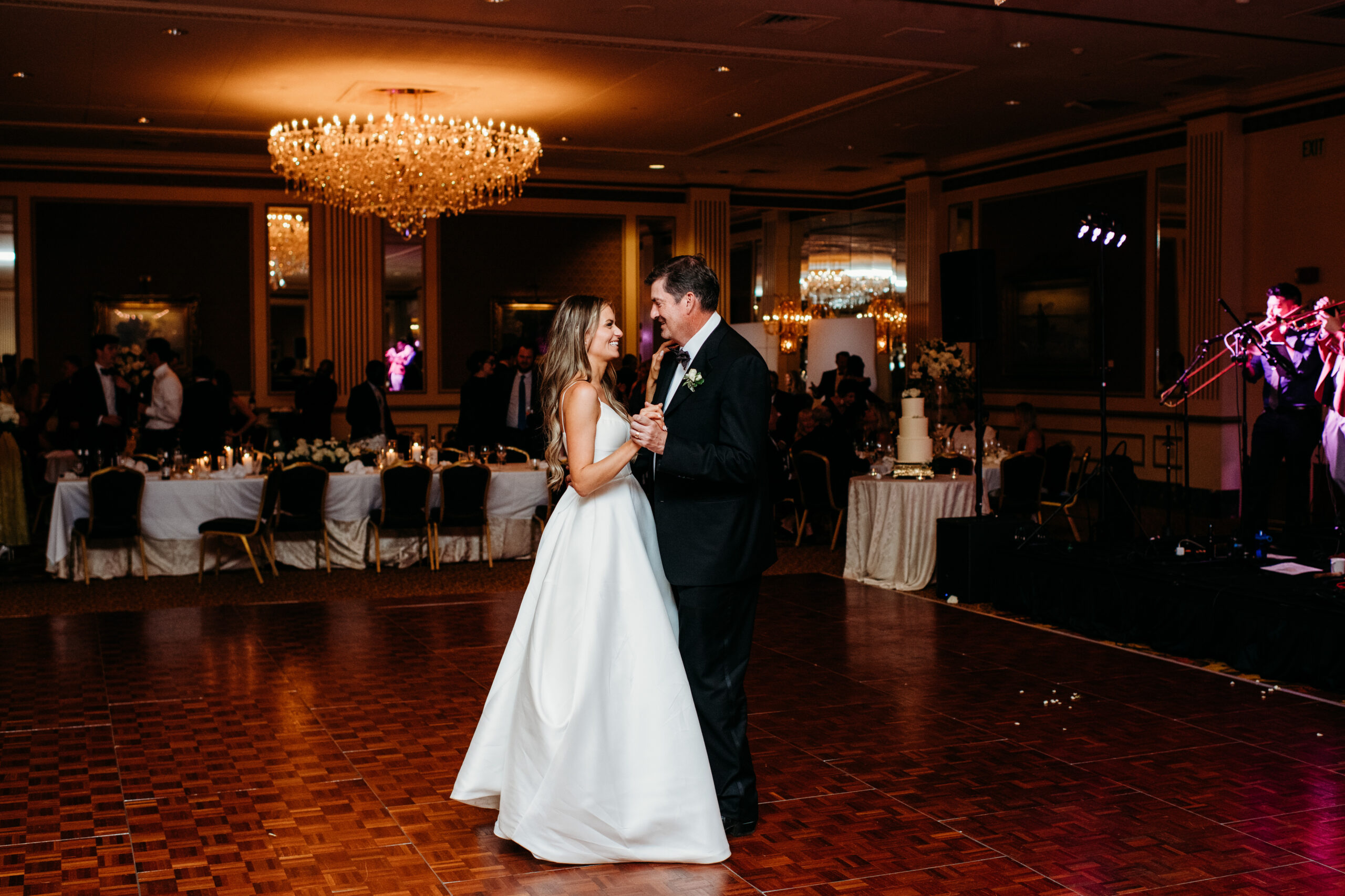 bride in white a frame gown dancing with her father at her Pfister Hotel Wedding